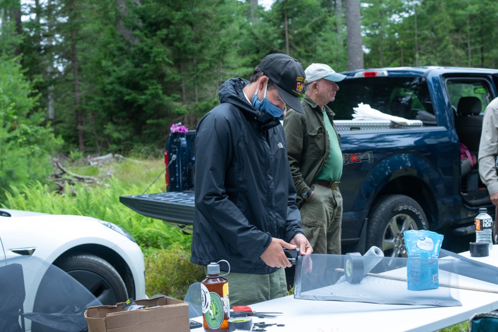 Flynn Willsea ’19 prepares wire bags to protect chestnut flowers from wildlife