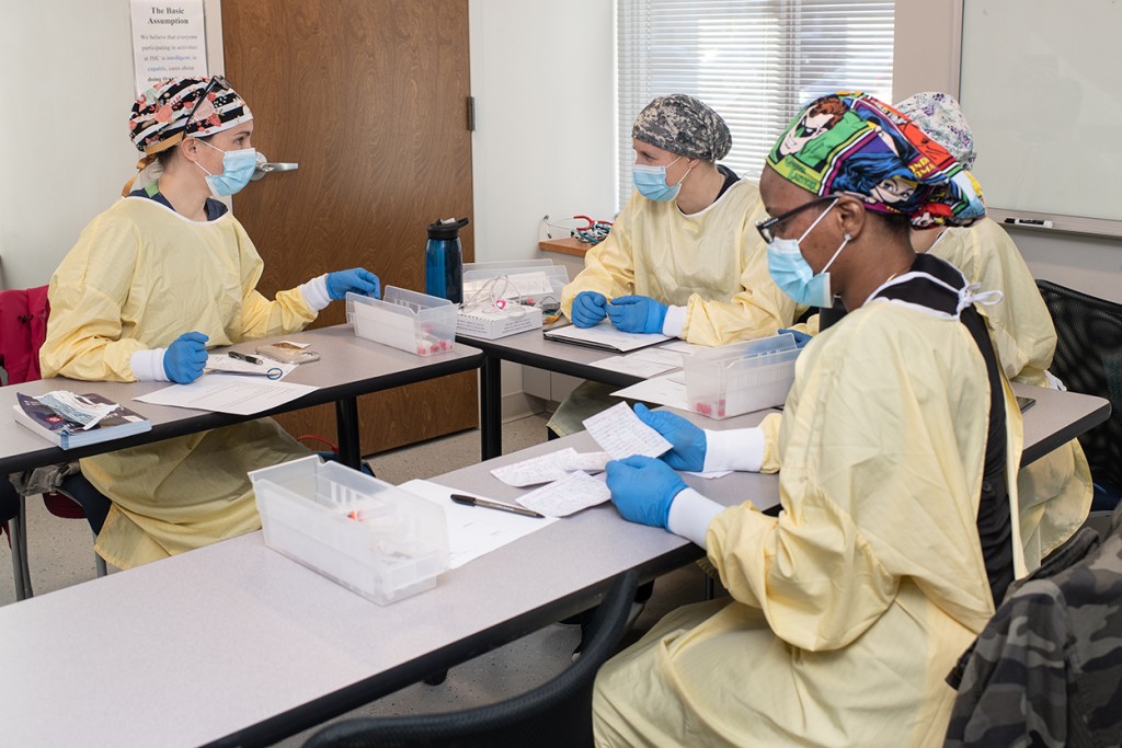 Four nursing anesthesia students sitting in a classroom