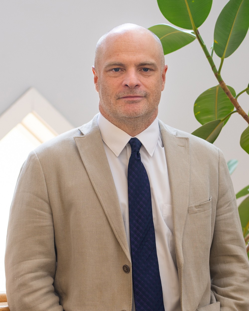 UNE's Norm O'Reilly poses for a portrait in the Portland Campus library