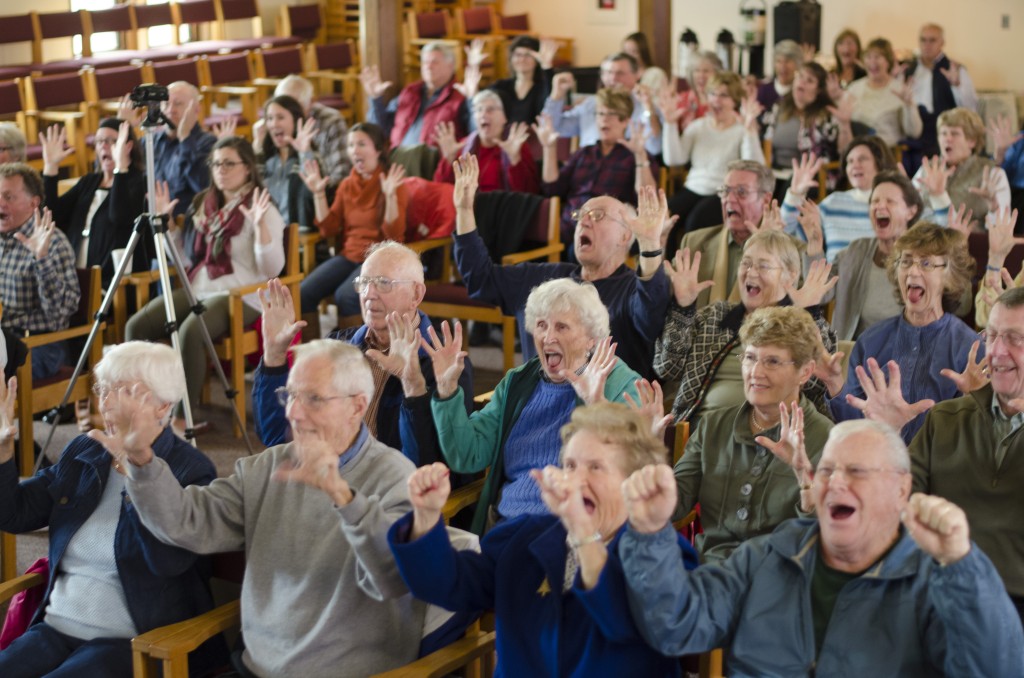 The audience did seated exercises to start the program