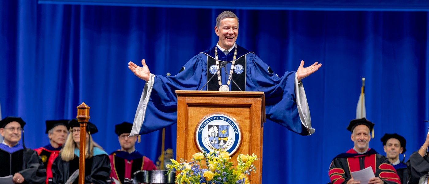 UNE President James Herbert speaks at the podium